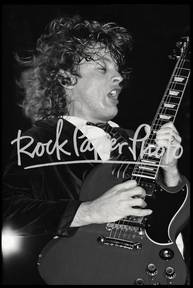 Angus Young by Ken Settle